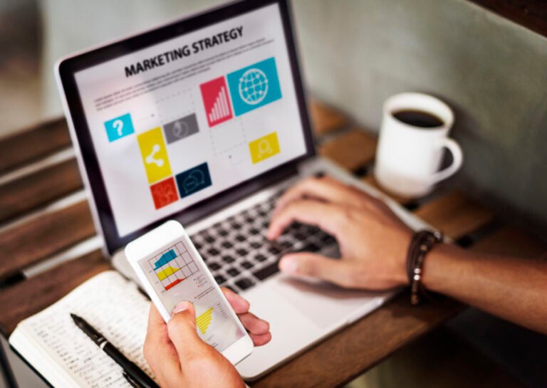 Digital devices connected around a central marketing strategy concept